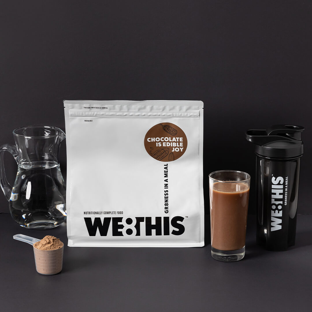 WE8THIS drink in glass with shaker and scoop